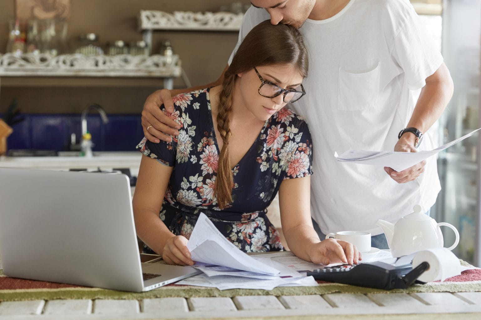 A homeowner reviewing mortgage figures at a kitchen table